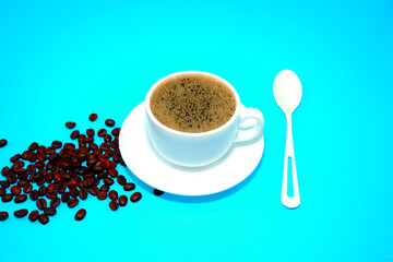 cup of coffee with spoon closeup view 