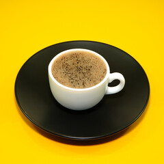 Coffee cup isolated on yellow background close-up view 