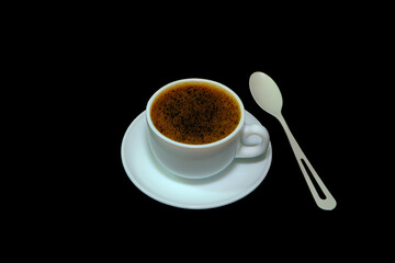 Cup of coffee with black background closeup view 