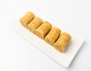 Rolled Baklava Isolated, Ramadan Dessert Roll on Restaurant Plate, Eastern Sweet Pastries