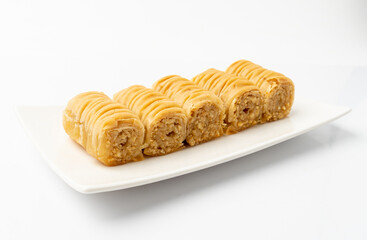 Rolled Baklava Isolated, Ramadan Dessert Roll on Restaurant Plate, Eastern Sweet Pastries