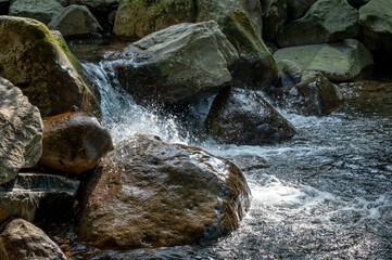 Close up of river flows between stone, in New Taipei City, Taiwan.