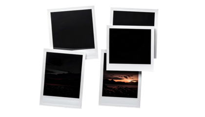 Stacked instant photos, some blank, some showing landscapes at sunset