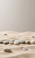 Zen garden concept with smooth, balanced stones on soft sand dunes against a neutral background for tranquility and mindfulness