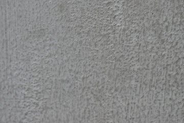 Calm gray abstract background with textured, rough wall surface. simple, raw pattern on concrete material shows minimalist detail