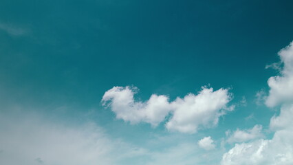 Time lapse. A stunningly tranquil sky adorned with soft clouds and vibrant blue hues creates a perfect view