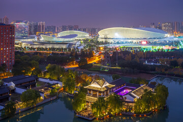 Fototapeta premium Suzhou Xietang Old Street and Olympic Sports Center ancient and modern architecture night view, China