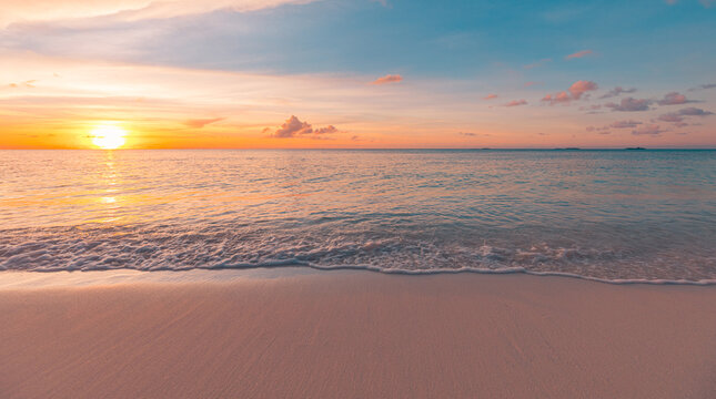 Picturesque closeup sea sand sky sunset. Majestic beach nature landscape, sunrise colors, relaxing peaceful calm serene beachfront. Tropical summer vacation scene. Best wallpaper, inspire meditation