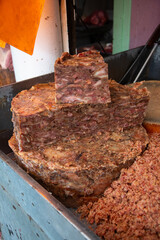 Butcher Stalls selling prepared meat for making tacos at the San Juan market in Mexico City.