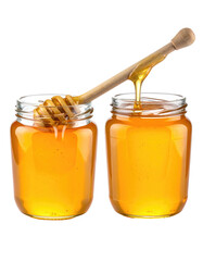 Two clear glass jars of honey, one with a wooden honey dipper pouring honey into the other