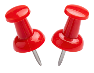 Two bright red pushpins on a black background