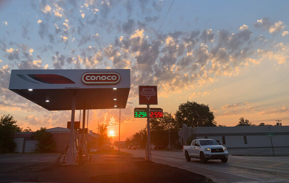 September 12, 2025, Sallisaw, Oklahoma. A Conoco gas station with fuel prices of $3.29 per gallon diesel, $2.59 per gallon gasoline, the sunrise in the distance with beautiful clouds, a pickup truck