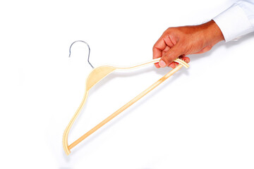 Wooden hanger holding hand on white background close-up view 