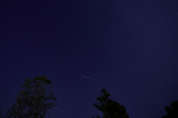 Night sky with shooting star meteor
