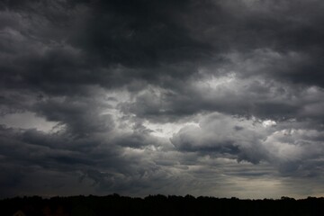 Clouds over the forest in summer
