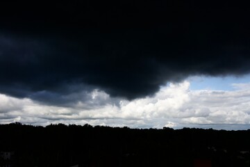 Clouds over the forest in summer