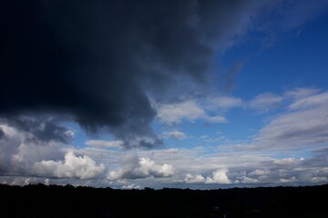 Clouds over the forest in summer