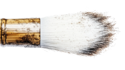 Close-up of a well-used paintbrush with a wooden handle and bristles covered in paint residue, perfect for artistic inspiration and creative projects