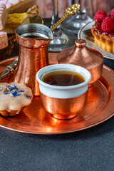 Coffee and selection of gourmet cakes  set up on a table