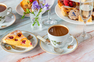 Coffee and selection of gourmet cakes set up on a table