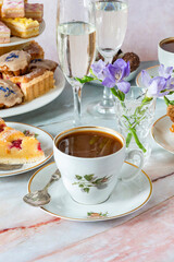 Coffee and selection of gourmet cakes set up on a table