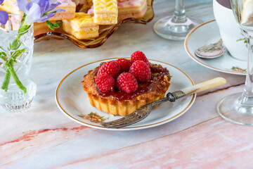 Coffee and selection of gourmet cakes set up on a table