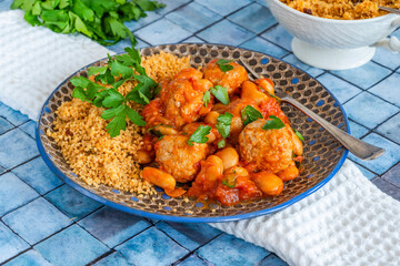 Pork meatballs in tomato sauce with couscous