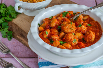 Pork meatballs in tomato sauce with couscous