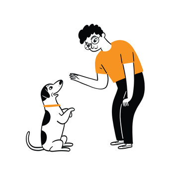 Man teaching and training his small dog a command, focusing on pet obedience and positive reinforcement.