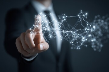 Businessman interacts with a network graphic. A hand in a suit touches a network of light