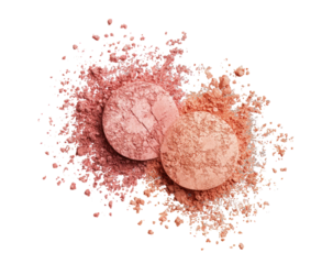 Two blush compacts, surrounded by scattered powder