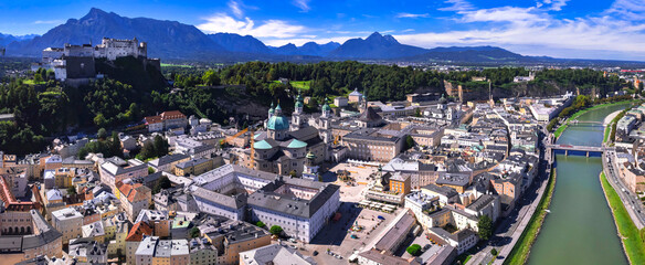 Salzburg - iconic town and great historic landmarks of Austria. aerial drone high agle view of old city with Hohensalzburg fortress and Salzach river