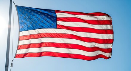 Waving American Flag Against a Clear Blue Sky.