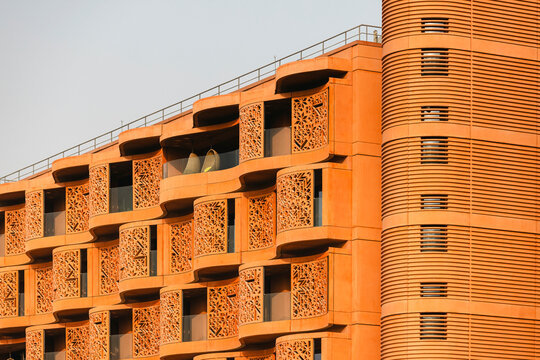 The Masdar Institute of Science and Technology exterior with green garden on the foreground. Sustainable environment.