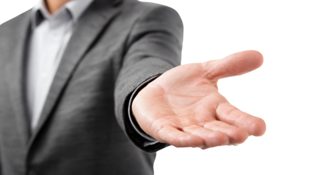 Man in a suit extending hand for a handshake, white isolated background.