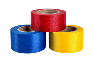 Three rolls of colorful self adhesive bandage in red, blue, and yellow isolated on transparent background