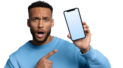 Surprised man in blue sweatshirt pointing at smartphone with empty screen, showcasing excitement and engagement in technology and social media context.