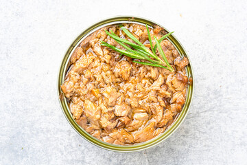 Canned tuna in brine isolated on vintage background	