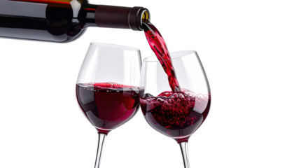 Red wine being poured into two stemmed glasses.  A bottle of red wine is partially visible, with liquid pouring into two wine glasses.  The glasses are filled with deep red wine.  A close-up view