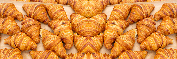 Mini croissant pattern. French puff pastries, chocolat bakery