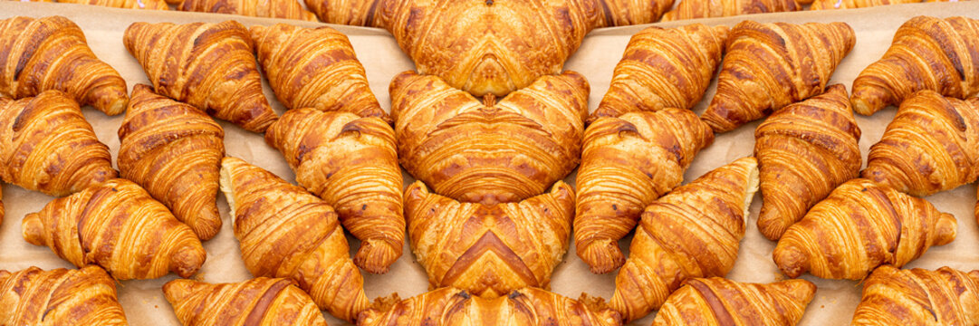 Mini croissant pattern. French puff pastries, chocolat bakery