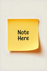 Yellow sticky note with the words "Note Here".
