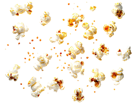 Scattered popcorn kernels on a black background