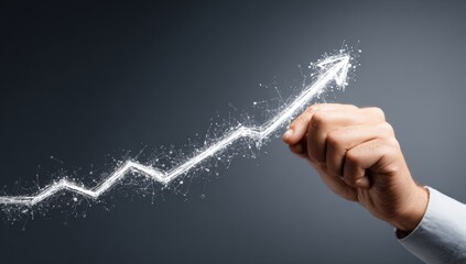 A hand draws a rising upward trend line