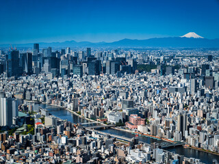 Aerial view of Tokyo city skyline with Mount Fuji in the background on a clear day in Japan.