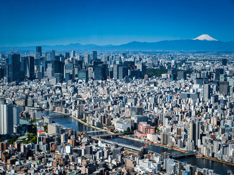 Aerial view of Tokyo city skyline with Mount Fuji in the background on a clear day in Japan.