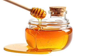 Honey dripping from a jar with a wooden dipper
