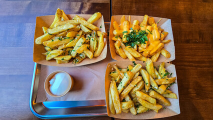 Classic french fries with herbs and cheese topping