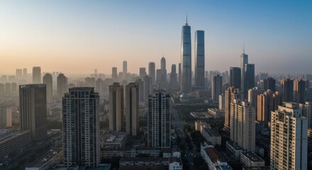 Obraz premium Aerial view of a dense city skyline at dawn. Foggy, modern urban landscape with towering skyscrapers