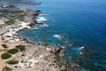 Fototapeta premium Aerial view of Mediterranean coastline near by The Edro III Shipwreck on sunny day. Peyia, Cyprus.
